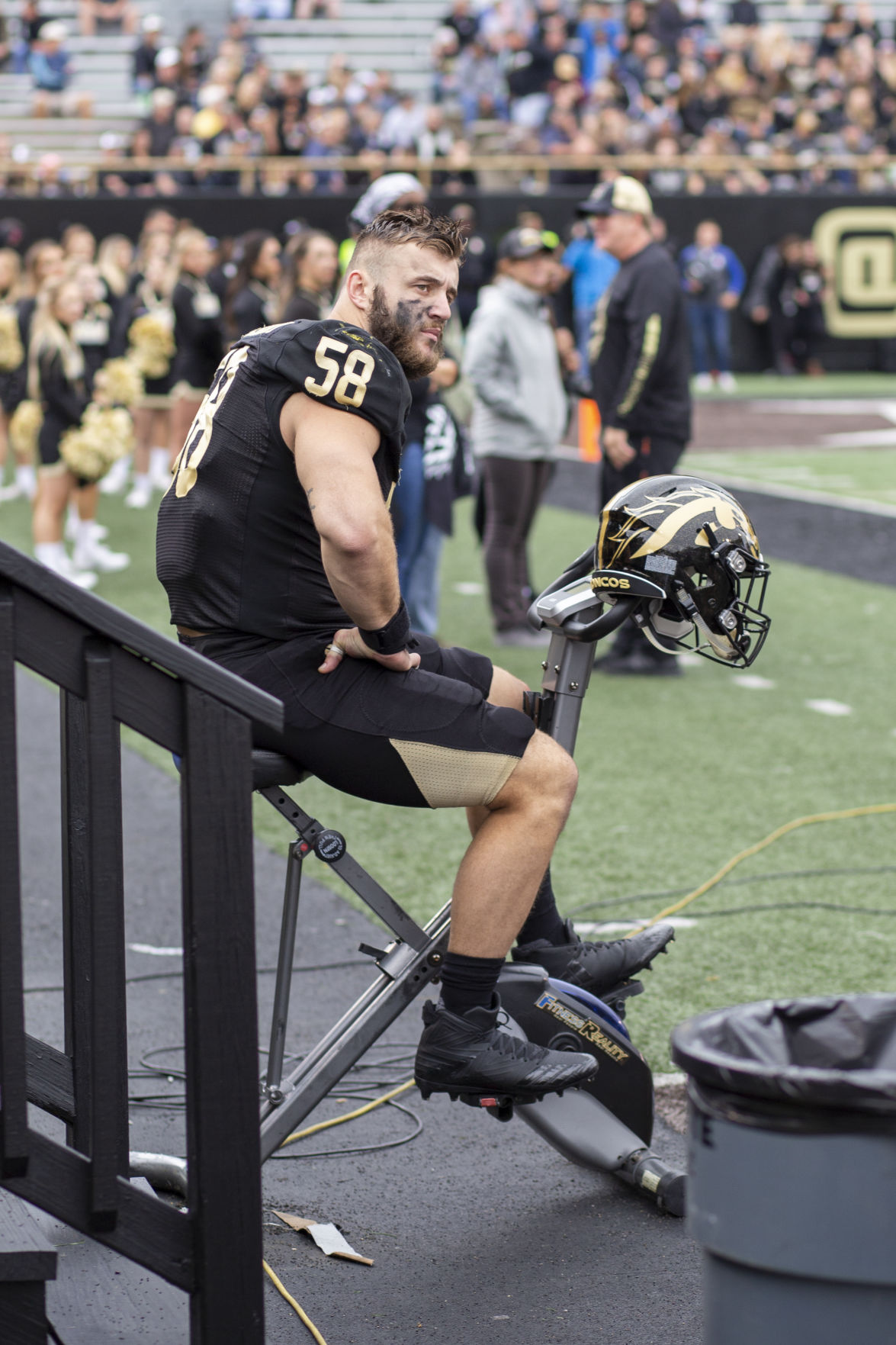 Defensive end Antonio Balabani keeps his legs warm during the second quarter as the offense takes the field.